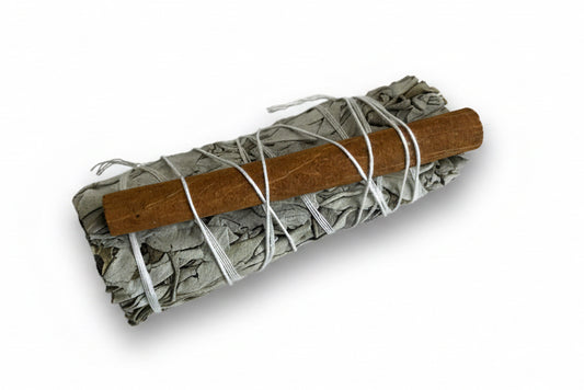 Smoldering sage stick hand wrapped with cinnamon in white string